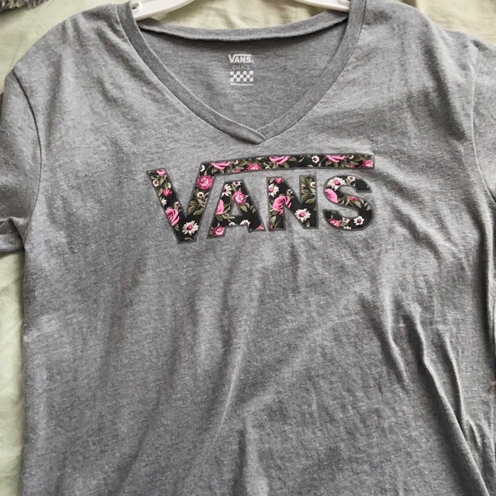 A Vans shirt that is a size small in women’s